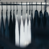 fashion showroom with black and white shirts hanging on rail