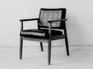 A padded armchair in black and white